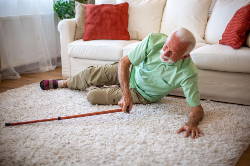 senior man on the floor of his living room having just experienced a fall