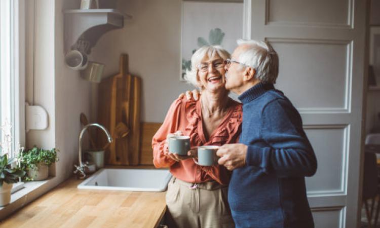 an older couple happy at home